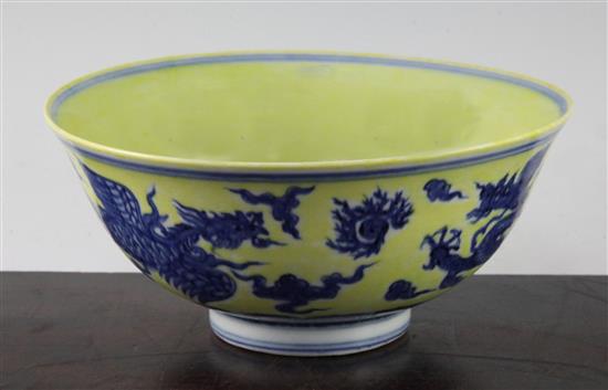 A Chinese yellow ground dragon and phoenix bowl, Xuande six character mark and possibly of the period, 19.5cm, museum restoration, sc